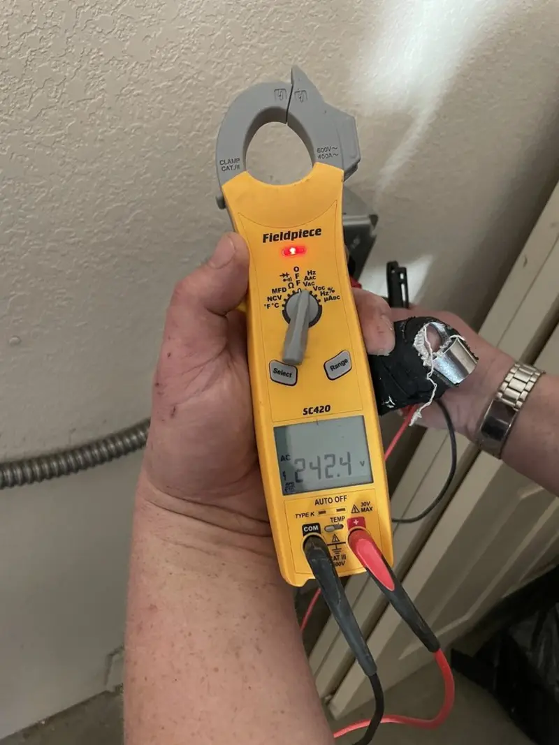 Voltage testing with clamp meter during Recessed Lighting Installation in Shelley